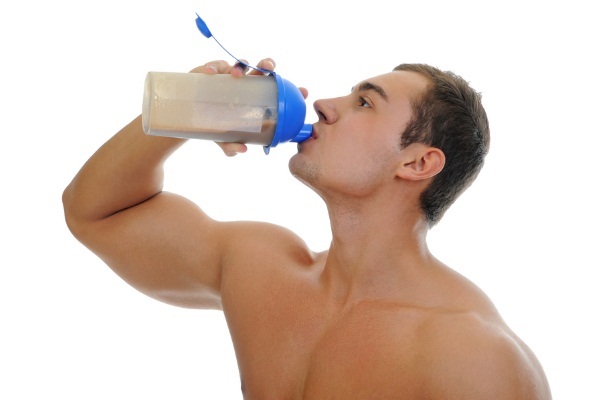 Stay Hydrated - Athlete drinks water during a workout.
