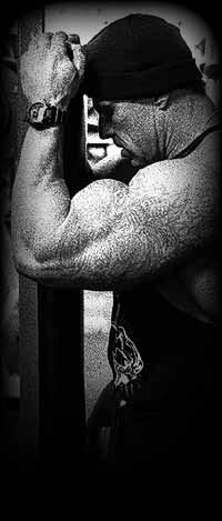 Bodybuilder working out in deep concentration!