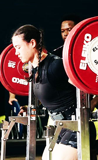 Young lady squating in a National Meet